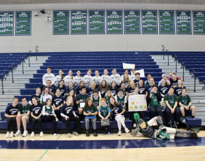 The program gets together for a photo after their basketball game vs Lake Forest High School on Feb. 6, 2025